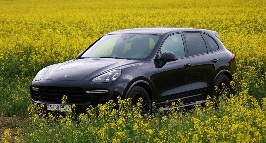 Porsche Cayenne GTS in a field of yellow wildflowers in southern California