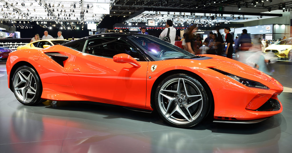 Ferrari F8 in Metallic Red on display at a car show