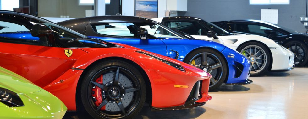 a line of luxury cars at Auto Concierge asset management company